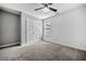 Comfortable bedroom includes a ceiling fan, closet, and a large window at 2885 Field Spring Dr, Lithonia, GA 30058