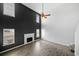 Bright living room boasts a fireplace, hardwood floors, and modern ceiling fan at 2885 Field Spring Dr, Lithonia, GA 30058