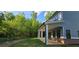 Covered backyard patio with brick accents and multiple columns, perfect for outdoor entertaining at 41 Birch Ct, Mcdonough, GA 30253