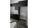 Modern kitchen featuring sleek black cabinetry and striking white countertops with black veining at 41 Birch Ct, Mcdonough, GA 30253