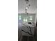 Bright kitchen showcasing a large center island with unique white countertops and black veining at 41 Birch Ct, Mcdonough, GA 30253