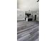 Spacious living room showcasing hardwood floors and an open floor plan into the modern kitchen at 41 Birch Ct, Mcdonough, GA 30253