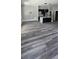 Spacious living room showcasing hardwood floors and an open floor plan into the modern kitchen at 41 Birch Ct, Mcdonough, GA 30253