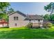 Backyard view of home featuring a wooden deck and lawn at 4331 Wrexham Ct, Snellville, GA 30039
