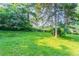 Large grassy backyard with mature trees at 4331 Wrexham Ct, Snellville, GA 30039