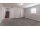 Basement featuring carpeting, stairs, and a small window at 4331 Wrexham Ct, Snellville, GA 30039