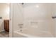 Clean bathroom with white fiberglass shower and chrome fixtures at 4331 Wrexham Ct, Snellville, GA 30039