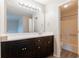 Bathroom with an espresso vanity, white counter top, and a shower/tub at 4331 Wrexham Ct, Snellville, GA 30039