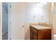 Bathroom with granite countertop, wood cabinet, and white door at 4331 Wrexham Ct, Snellville, GA 30039