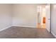 Bedroom featuring gray carpet and a doorway to the bathroom at 4331 Wrexham Ct, Snellville, GA 30039