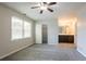 Bright bedroom featuring neutral walls, carpet flooring, ceiling fan, and ensuite bathroom and walk-in closet at 4331 Wrexham Ct, Snellville, GA 30039