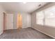 Well-lit carpeted bedroom featuring neutral walls, a window and closets at 4331 Wrexham Ct, Snellville, GA 30039