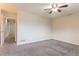 Spacious bedroom featuring gray carpet and a ceiling fan at 4331 Wrexham Ct, Snellville, GA 30039