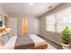 Inviting bedroom with neutral tones, plush bedding, and ample natural light at 4331 Wrexham Ct, Snellville, GA 30039