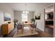 Elegant dining room with stylish furniture and ample natural light at 4331 Wrexham Ct, Snellville, GA 30039