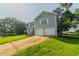 Split-level home with two car garage, attractive siding, and green lawn at 4331 Wrexham Ct, Snellville, GA 30039