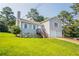 Split-level house with two-car garage, stone accents, and inviting front yard at 4331 Wrexham Ct, Snellville, GA 30039
