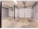 Garage featuring concrete floors and two garage doors with modern openers at 4331 Wrexham Ct, Snellville, GA 30039