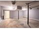 Garage featuring concrete floors, open ceiling, and an entrance door at 4331 Wrexham Ct, Snellville, GA 30039