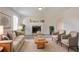 Bright and airy living room featuring a fireplace, neutral tones, and comfortable seating at 4331 Wrexham Ct, Snellville, GA 30039