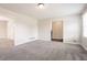 Open and airy living room boasting neutral paint and plush carpet at 4331 Wrexham Ct, Snellville, GA 30039