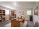 Bright home office with a large desk, ample storage, and comfortable seating for productivity at 4331 Wrexham Ct, Snellville, GA 30039