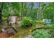 Backyard shed and vintage trailer on a wooden walkway at 1736 Morris Landers Ne Dr, Atlanta, GA 30345