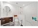 Modern bathroom with stylish vanity, circular mirror, and walk-in shower with white subway tile at 1736 Morris Landers Ne Dr, Atlanta, GA 30345