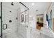 Bathroom with tiled shower, modern fixtures, and bright vanity with dual sinks at 1736 Morris Landers Ne Dr, Atlanta, GA 30345