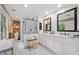 Bathroom featuring dual sinks, bright vanity, and a walk-in shower with glass door at 1736 Morris Landers Ne Dr, Atlanta, GA 30345