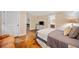 Well-lit bedroom with doorway to bathroom offers comfortable bed and dresser with television at 1736 Morris Landers Ne Dr, Atlanta, GA 30345