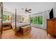 This bedroom features a ceiling fan, hardwood floors, and plenty of natural light at 1736 Morris Landers Ne Dr, Atlanta, GA 30345