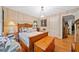 A bedroom featuring hardwood floors, a unique light fixture, and decorative trim at 1736 Morris Landers Ne Dr, Atlanta, GA 30345