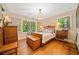 This bedroom features hardwood floors, detailed trim, and a decorative light fixture at 1736 Morris Landers Ne Dr, Atlanta, GA 30345