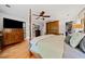 Bedroom featuring hardwood floors, four-poster bed, and ensuite bathroom at 1736 Morris Landers Ne Dr, Atlanta, GA 30345