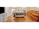 Cozy bedroom features a soft bed, bedside tables with lamps, and a comfortable orange couch at 1736 Morris Landers Ne Dr, Atlanta, GA 30345