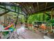 Charming deck with comfortable seating, rocking chairs, and views of the trees and hot tub at 1736 Morris Landers Ne Dr, Atlanta, GA 30345