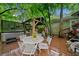 Outdoor deck area features a table, seating, and hot tub surrounded by lush green trees at 1736 Morris Landers Ne Dr, Atlanta, GA 30345