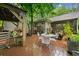 Outdoor deck with table, seating and lush greenery perfect for relaxation and entertainment at 1736 Morris Landers Ne Dr, Atlanta, GA 30345