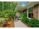 Inviting front entrance with lush landscaping, flower beds, and a charming walkway leading to the front door at 1736 Morris Landers Ne Dr, Atlanta, GA 30345