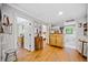 Hallway featuring wood floors, decorative furniture, and doorways leading to a bedroom and bathroom at 1736 Morris Landers Ne Dr, Atlanta, GA 30345