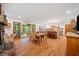 Open-concept kitchen boasts hardwood floors, an island with seating, and access to a screened-in porch at 1736 Morris Landers Ne Dr, Atlanta, GA 30345