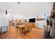An open kitchen with a dining area, hardwood floors, stainless steel appliances, and a view of the backyard at 1736 Morris Landers Ne Dr, Atlanta, GA 30345