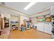 Spacious laundry room with washer, dryer, storage shelves, and a convenient utility sink at 1736 Morris Landers Ne Dr, Atlanta, GA 30345