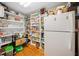 Large pantry with abundant shelving space for storage and a refrigerator at 1736 Morris Landers Ne Dr, Atlanta, GA 30345