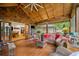 The screened porch boasts wood floors, comfortable seating, and views of the backyard and access to the interior spaces at 1736 Morris Landers Ne Dr, Atlanta, GA 30345