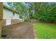 Backyard with a concrete patio and lush lawn, ideal for outdoor activities at 2056 Merle Se Dr, Conyers, GA 30013