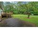Spacious backyard with a concrete patio and wooden deck, perfect for entertaining at 2056 Merle Se Dr, Conyers, GA 30013