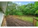 Wide view of a wooden deck overlooking the large and private backyard at 2056 Merle Se Dr, Conyers, GA 30013