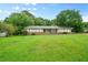 Charming single-story home with a large front yard and a welcoming porch at 2056 Merle Se Dr, Conyers, GA 30013